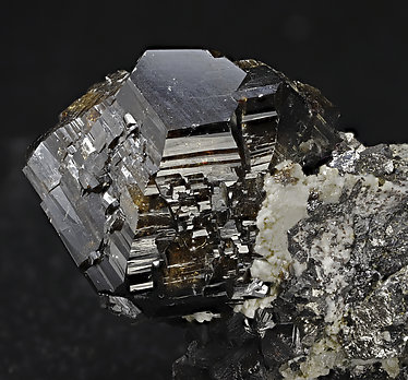 Cassiterite with Calcite, Arsenopyrite and Quartz. Photo: Joaquim Calln