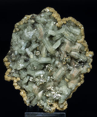 Fluorapatite with Pyrite, Siderite and Muscovite. 