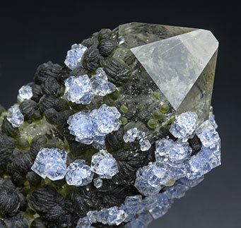 Fluorite with Topaz, Quartz, Arsenopyrite and Muscovite. 