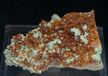 Grossular (variety hessonite) with Chlorite. 
