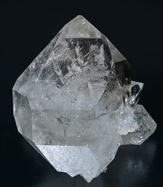 Quartz (doubly terminated) with hydrocarbon inclusions.