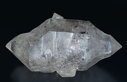 Quartz (doubly terminated) with hydrocarbon inclusions. Rear