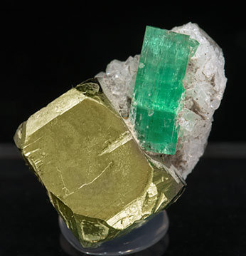 Beryl (variety emerald) with Pyrite and Calcite. 