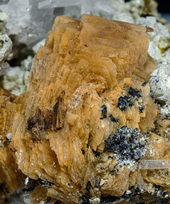 Roweite with Olshanskyite, Andradite and Calcite. 