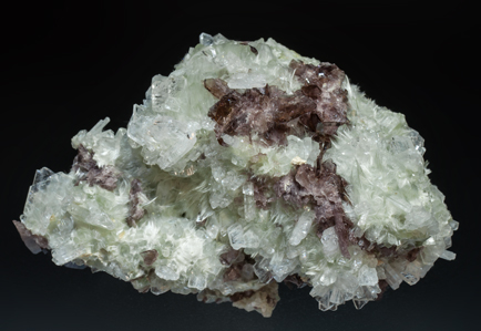 Axinite-(Fe) on Albite and Actinolite (variety byssolite).