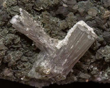 Fluorapatite with Sphalerite, Muscovite and Chlorite. 