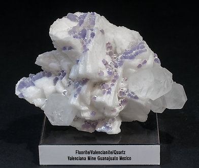 Fluorite with Quartz and Feldspar (variety valencianite). 