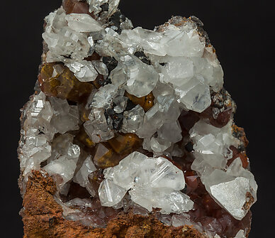 Cerussite on Quartz with iron oxides inclusions. 