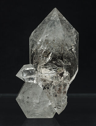 Quartz doubly terminated with hydrocarbon inclusions.
