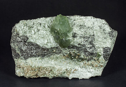 Prehnite with Orthoclase (variety adular) and Actinolite (variety byssolite). 