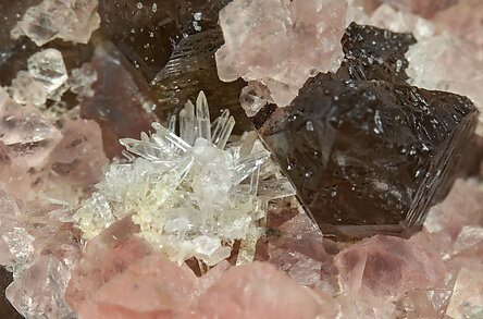 Fluorite (octahedral) with Milarite and Quartz (variety smoky quartz). 