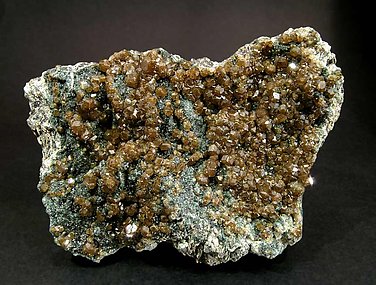 Andradite (variety topazolite) with Clinochlore. 