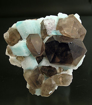 Quartz (variety smoky) with Microcline (variety amazonite) and Fluorite. 