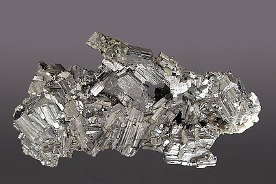 Arsenopyrite with Siderite and Pyrite. 