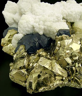 Pyrite and Chalcopyrite with Calcite. 
