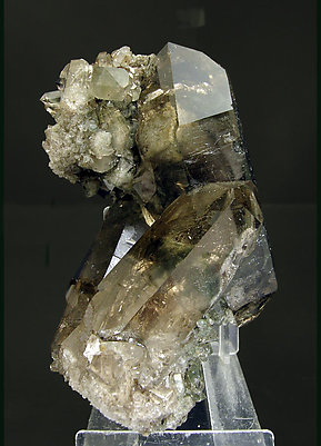 Quartz (variety smoky) with inclusions and Chlorite.