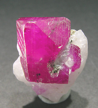 Corundum (variety ruby) with Calcite. Front
