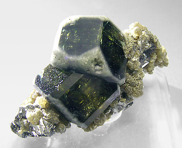 Fluorapatite with Muscovite and Arsenopyrite.