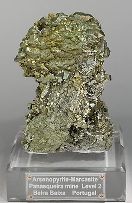 Epitactic Arsenopyrite-Marcasite with Calcite, Siderite and Chalcopyrite.