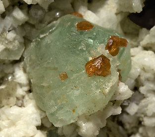 Fluorite with Albite (Pericline), Spessartine and Muscovite. 