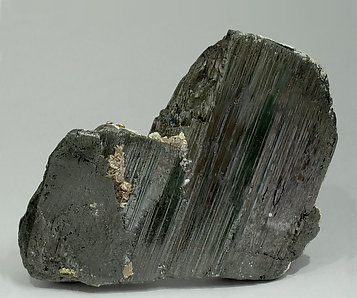 Ferberite with Muscovite, Calcite, Pyrite and Chalcopyrite. Front
