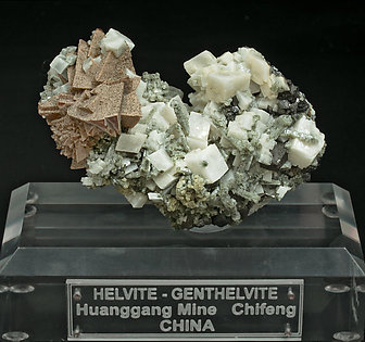 Helvine-Genthelvite, Quartz and Calcite. 