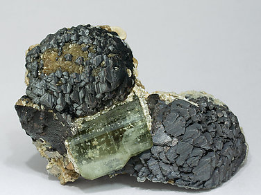 Fluorapatite with Sphalerite, Muscovite, Calcite, Siderite and Pyrite.