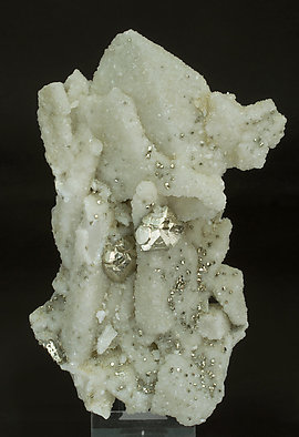 Pyrite on Quartz and Calcite-Dolomite.