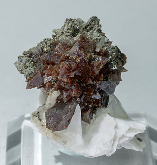 Helvine-Danalite with Calcite and Chlorite. 
