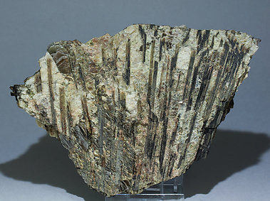 Allanite-(Ce) with Muscovite, Spessartine and perthite. 