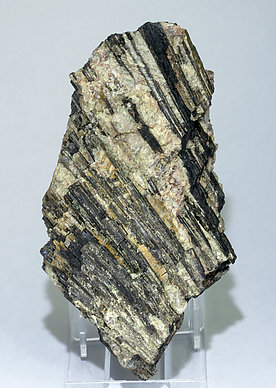 Allanite-(Ce) with Muscovite, Spessartine and perthite. 