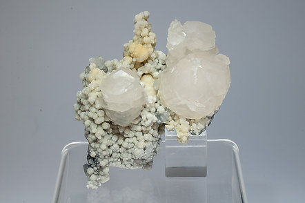 Calcite with inclusions of 'plumosite'.