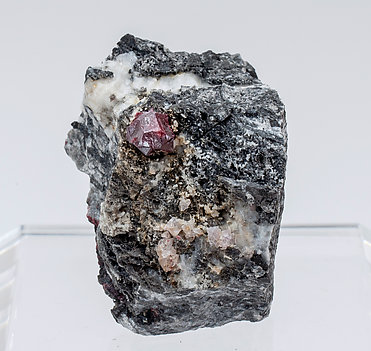 Cinnabar (twinned) with Quartz and Calcite.