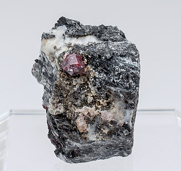 Cinnabar (twinned) with Quartz and Calcite. 