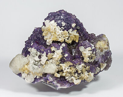 Fluorite with Calcite, Baryte and Dolomite.