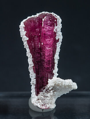 Elbaite-Schorl Series (variety rubellite) with Feldspar and Quartz.