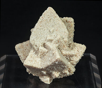 Calcite with sand inclusions.