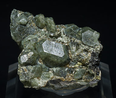 Topaz with Chlorite inclusions, Arsenopyrite, Chalcopyrite and Muscovite. 