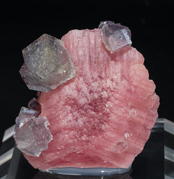 Rhodochrosite with Fluorite and inclusions.