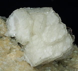 Siderite with Dolomite, Calcite, Ferberite and Pyrite. 