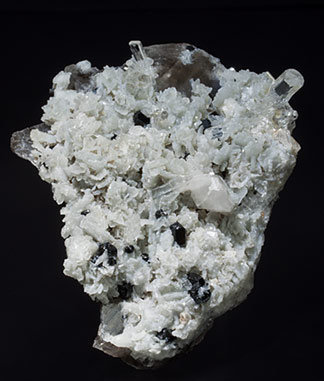 Twinned Phenakite with Albite, Schorl and Quartz (variety smoky).