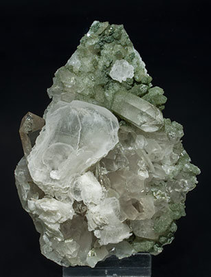 Calcite (variety papierspat) with Quartz (variety smoky quartz) and Chlorite.