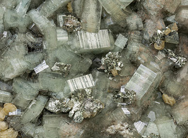 Fluorapatite with Pyrite, Siderite and Muscovite. 