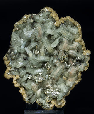 Fluorapatite with Pyrite, Siderite and Muscovite.