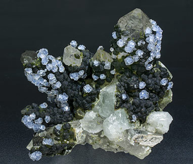 Fluorite with Topaz, Quartz, Arsenopyrite and Muscovite. 