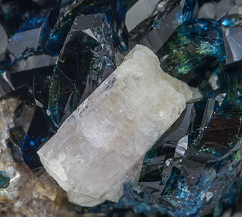 Fluorapatite with Lazulite, Quartz and Siderite. 