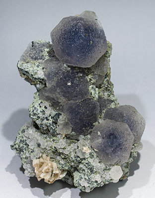 Fluorite with Siderite, Calcite, Chlorite and Arsenopyrite.