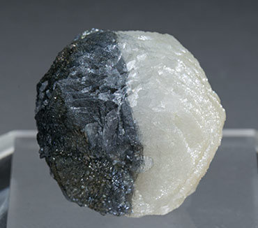 Calcite with Boulangerite inclusions. Rear