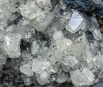 Topaz with Chlorite, Muscovite, Pyrite, Fluorapatite and Siderite. 