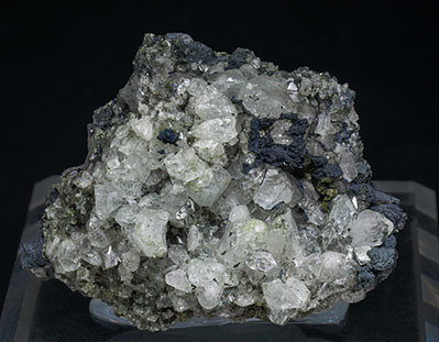 Topaz with Chlorite, Muscovite, Pyrite, Fluorapatite and Siderite.